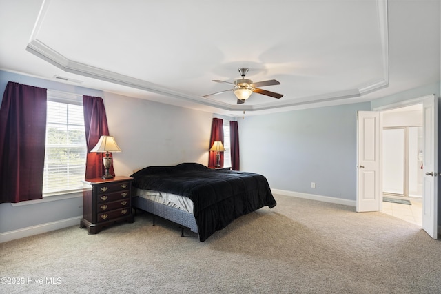 1427 Hammocks Beach Rd, Swansboro, NC 28584 - bedroom with a raised ceiling, light colored carpet, multiple windows, and crown molding