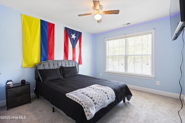 1427 Hammocks Beach Rd, Swansboro, NC 28584 - carpeted bedroom featuring baseboards and a ceiling fan