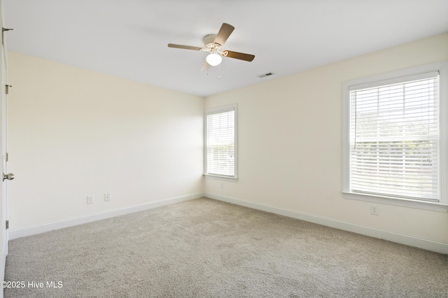 1427 Hammocks Beach Rd, Swansboro, NC 28584 - carpeted spare room featuring a ceiling fan and baseboards