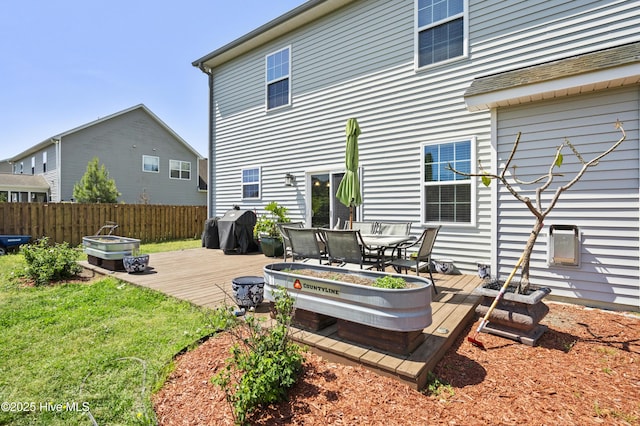 1427 Hammocks Beach Rd, Swansboro, NC 28584 - back of property with a deck and outdoor dining space
