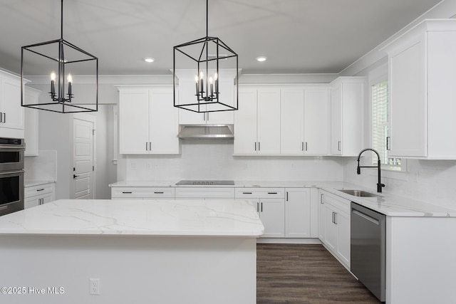 738 Hollybriar Loop Rd SE, Bolivia, NC 28422 - kitchen with a chandelier, stainless steel appliances, a sink, decorative backsplash, and white cabinets