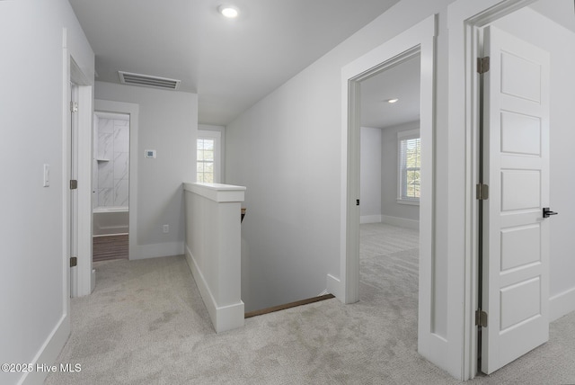 738 Hollybriar Loop Rd SE, Bolivia, NC 28422 - hallway with an upstairs landing, carpet floors, and baseboards