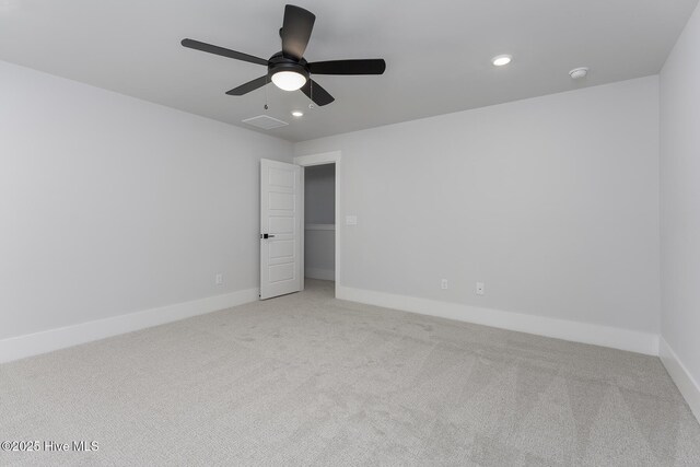 738 Hollybriar Loop Rd SE, Bolivia, NC 28422 - carpeted empty room with a ceiling fan, baseboards, recessed lighting, and a smoke detector
