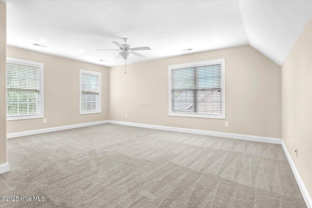 interior space with light colored carpet, visible vents, baseboards, and ceiling fan