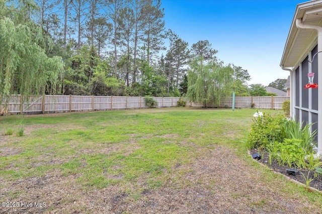 view of yard featuring a fenced backyard