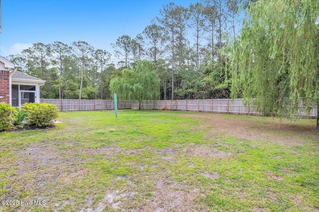 view of yard with a fenced backyard