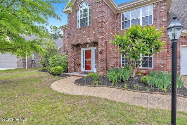traditional home with brick siding and a front yard