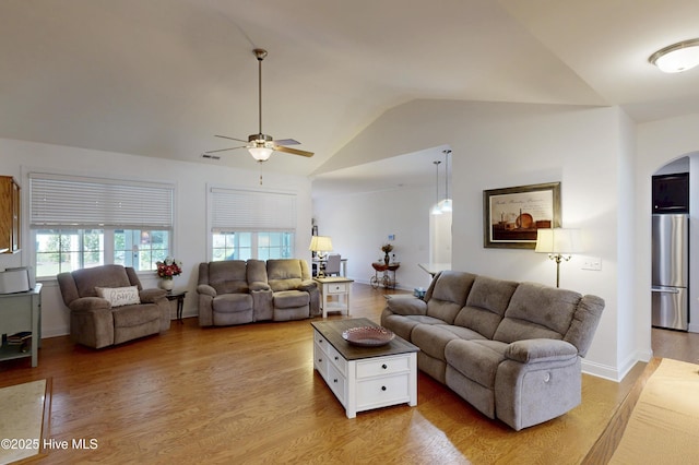 429 Canvasback Ln, Sneads Ferry, NC 28460 - living room with vaulted ceiling, arched walkways, ceiling fan, and light wood finished floors