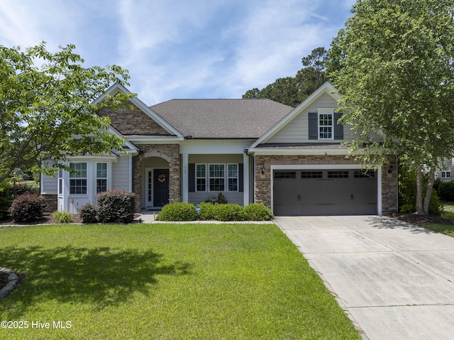 429 Canvasback Ln, Sneads Ferry, NC 28460 - view of front facade featuring stone siding, driveway, and a front yard