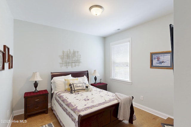 429 Canvasback Ln, Sneads Ferry, NC 28460 - bedroom featuring light wood-type flooring and baseboards