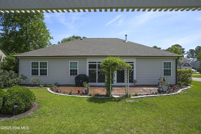 429 Canvasback Ln, Sneads Ferry, NC 28460 - rear view of property featuring a patio, a yard, and a shingled roof