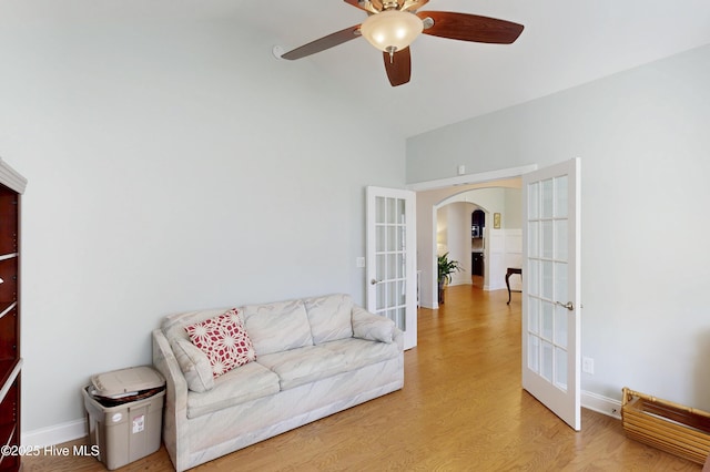429 Canvasback Ln, Sneads Ferry, NC 28460 - living room with french doors, arched walkways, a ceiling fan, high vaulted ceiling, and light wood-type flooring