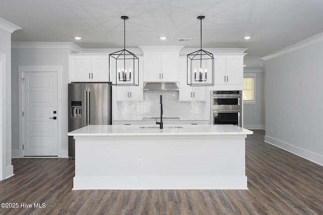 735 Hollybriar Loop Rd SE, Bolivia, NC 28422 - kitchen with stainless steel appliances, ornamental molding, baseboards, a chandelier, and white cabinetry