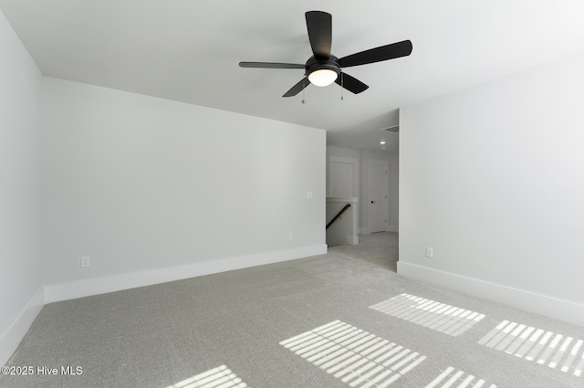 735 Hollybriar Loop Rd SE, Bolivia, NC 28422 - unfurnished room with light carpet, ceiling fan, and baseboards