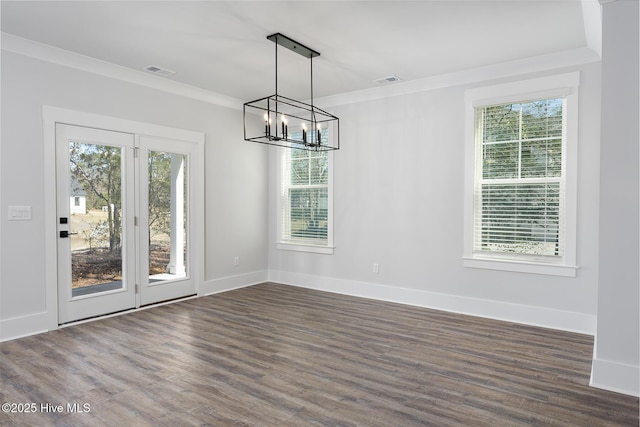 735 Hollybriar Loop Rd SE, Bolivia, NC 28422 - unfurnished dining area with a chandelier, dark wood-type flooring, baseboards, and crown molding