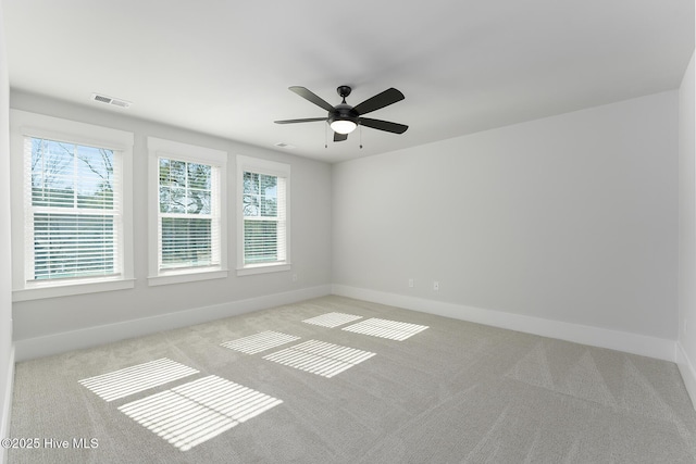 735 Hollybriar Loop Rd SE, Bolivia, NC 28422 - carpeted spare room with baseboards and ceiling fan