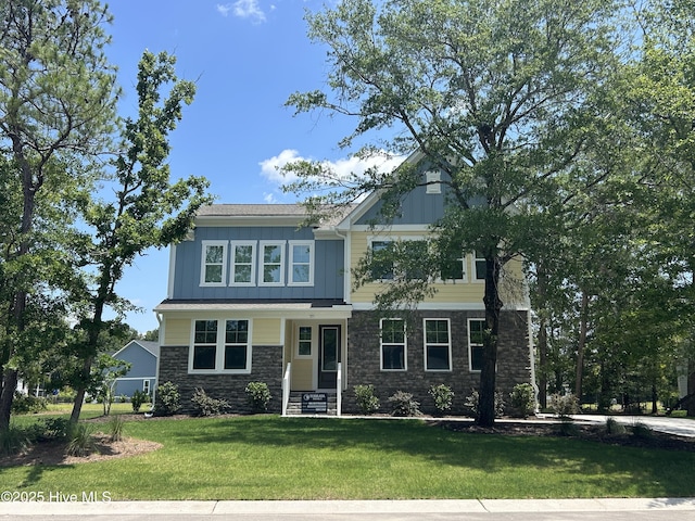 735 Hollybriar Loop Rd SE, Bolivia, NC 28422 - craftsman house with stone siding, board and batten siding, and a front lawn