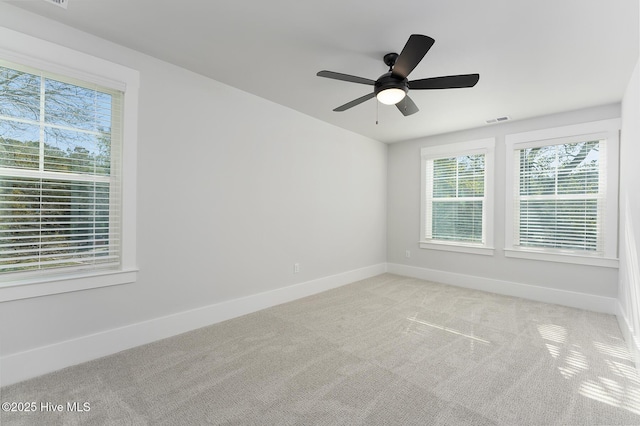 735 Hollybriar Loop Rd SE, Bolivia, NC 28422 - carpeted empty room featuring healthy amount of natural light, baseboards, and ceiling fan