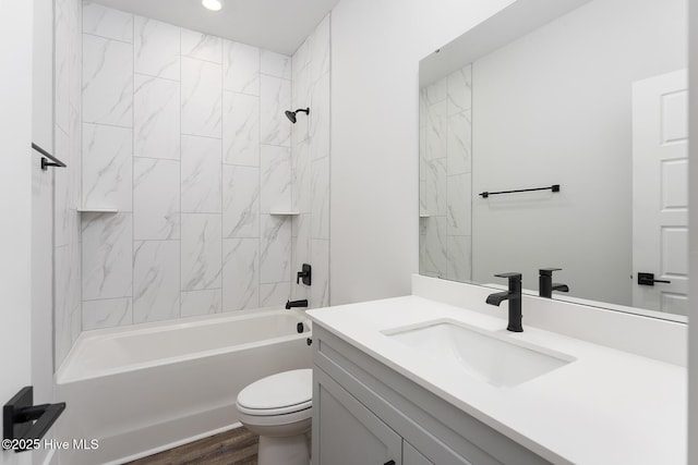 735 Hollybriar Loop Rd SE, Bolivia, NC 28422 - full bathroom featuring vanity, toilet, shower / washtub combination, wood finished floors, and recessed lighting