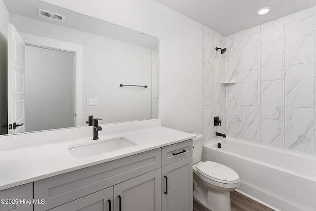 735 Hollybriar Loop Rd SE, Bolivia, NC 28422 - full bath with toilet, vanity, bathtub / shower combination, recessed lighting, and wood finished floors