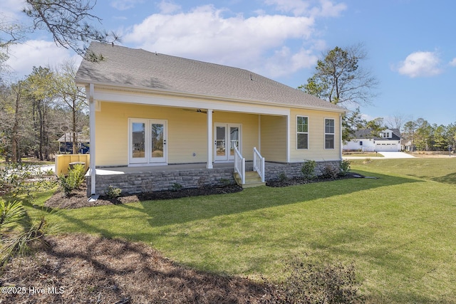 735 Hollybriar Loop Rd SE, Bolivia, NC 28422 - view of front of home featuring french doors and a front lawn