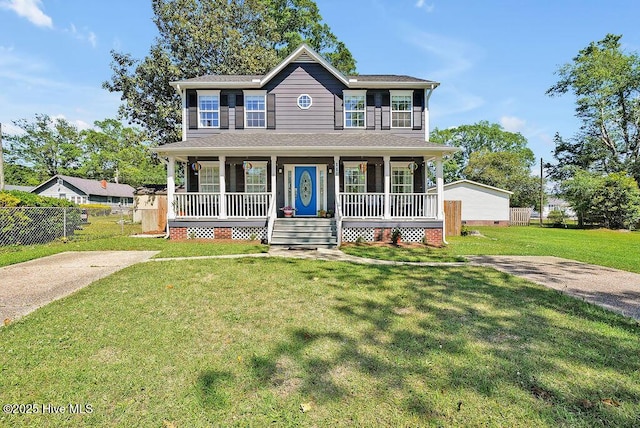 view of front of home featuring a front yard, a porch, and fence