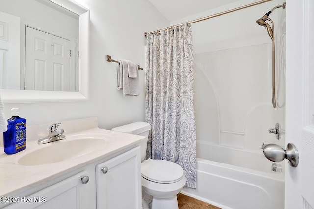 bathroom featuring shower / tub combo with curtain, vanity, and toilet