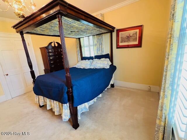 45 Hb Lewis Rd, Clinton, NC 28328 - carpeted bedroom featuring ornamental molding, a chandelier, and baseboards