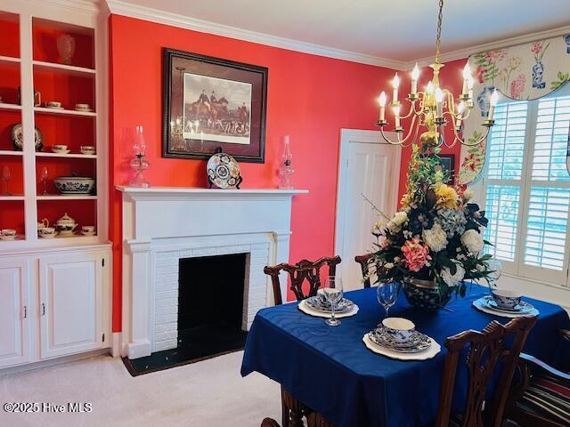 45 Hb Lewis Rd, Clinton, NC 28328 - carpeted dining room with a chandelier, healthy amount of natural light, crown molding, a brick fireplace, and built in features