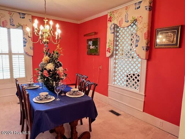 45 Hb Lewis Rd, Clinton, NC 28328 - dining room with carpet floors, a chandelier, healthy amount of natural light, and crown molding