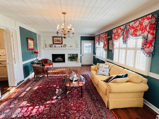 45 Hb Lewis Rd, Clinton, NC 28328 - living area with a chandelier, wood finished floors, a fireplace, baseboards, and wooden ceiling