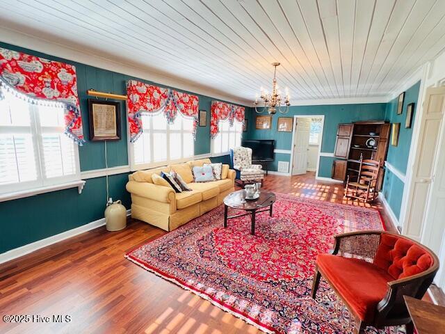 45 Hb Lewis Rd, Clinton, NC 28328 - living area with a chandelier, wood finished floors, baseboards, crown molding, and wooden ceiling