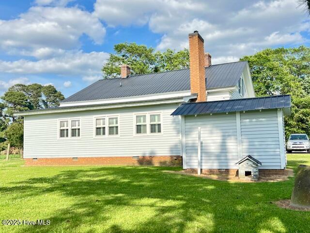 45 Hb Lewis Rd, Clinton, NC 28328 - back of house with crawl space, a yard, a chimney, an outbuilding, and metal roof