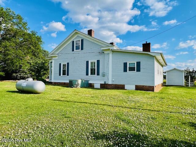 45 Hb Lewis Rd, Clinton, NC 28328 - rear view of house featuring a chimney and a lawn