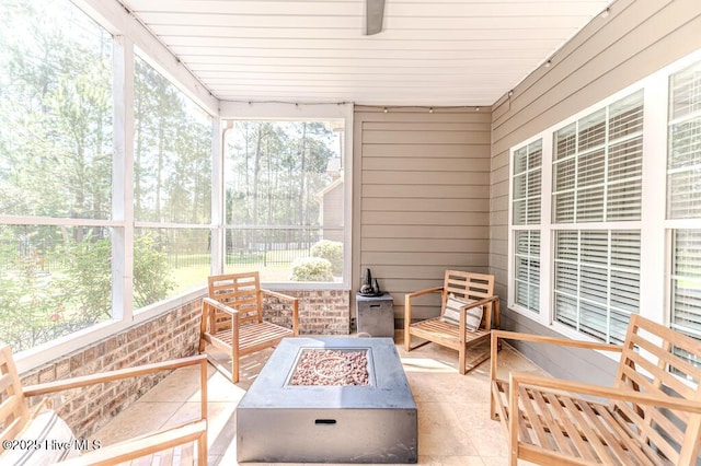 sunroom / solarium with a fire pit