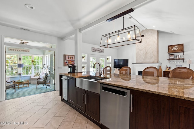 4145 Brighton Ln, Southport, NC 28461 - kitchen with lofted ceiling, french doors, decorative light fixtures, dishwasher, and open floor plan