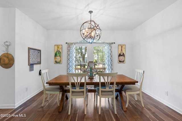 4145 Brighton Ln, Southport, NC 28461 - dining area featuring a notable chandelier, baseboards, and wood finished floors