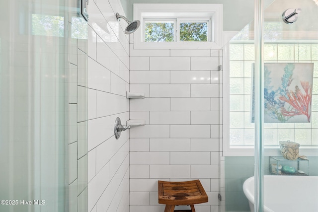 4145 Brighton Ln, Southport, NC 28461 - bathroom featuring a freestanding bath and tiled shower