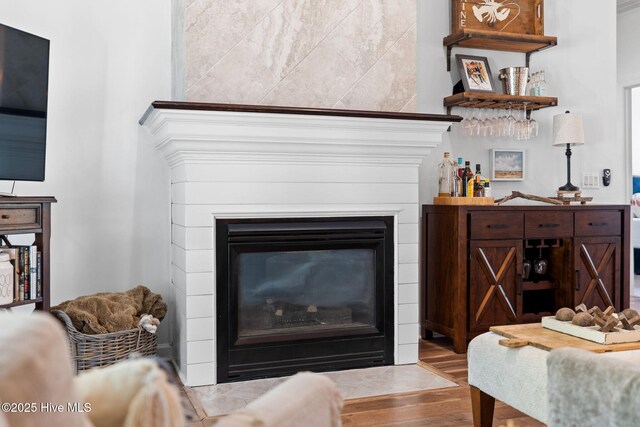 4145 Brighton Ln, Southport, NC 28461 - living area featuring a fireplace with flush hearth and wood finished floors