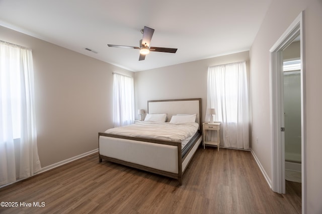 4524 Sweet Williams Ln NW, Wilson, NC 27896 - bedroom with a ceiling fan, visible vents, wood finished floors, and baseboards