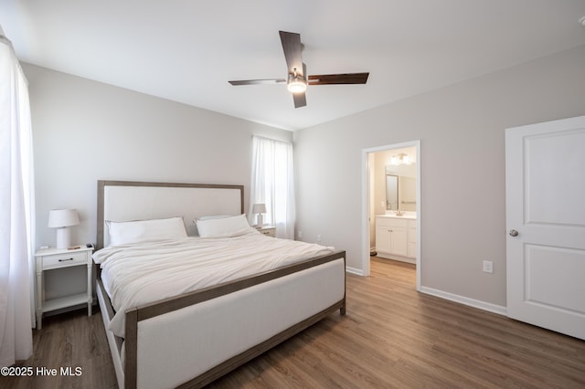 4524 Sweet Williams Ln NW, Wilson, NC 27896 - bedroom featuring a ceiling fan, ensuite bath, wood finished floors, and baseboards