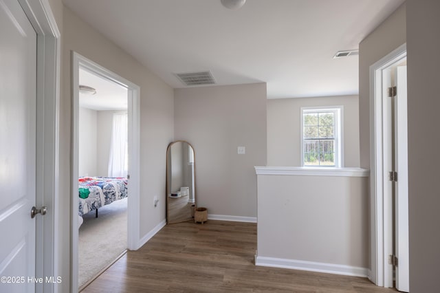 4524 Sweet Williams Ln NW, Wilson, NC 27896 - corridor with baseboards, visible vents, and dark wood-type flooring
