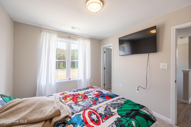 4524 Sweet Williams Ln NW, Wilson, NC 27896 - bedroom featuring visible vents and baseboards