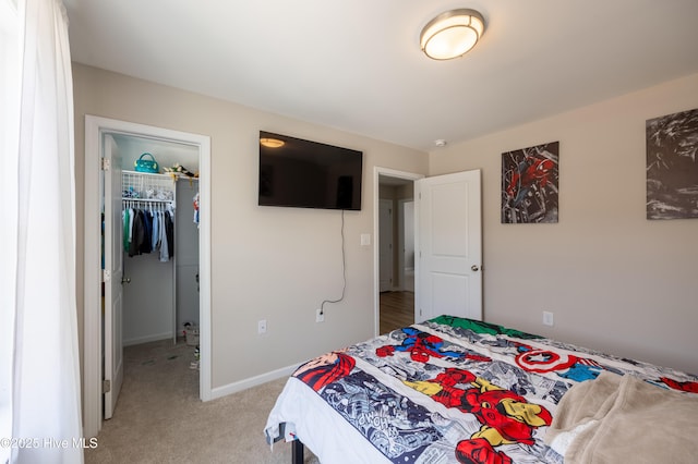 4524 Sweet Williams Ln NW, Wilson, NC 27896 - bedroom featuring light colored carpet, a spacious closet, a closet, and baseboards