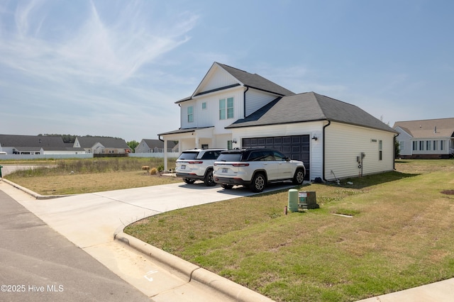 4524 Sweet Williams Ln NW, Wilson, NC 27896 - view of property exterior featuring board and batten siding, a garage, driveway, and a lawn
