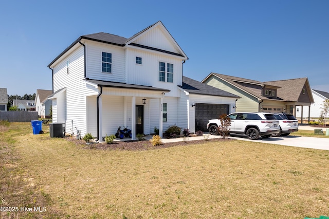 4524 Sweet Williams Ln NW, Wilson, NC 27896 - modern inspired farmhouse featuring a front lawn, driveway, a garage, and central AC