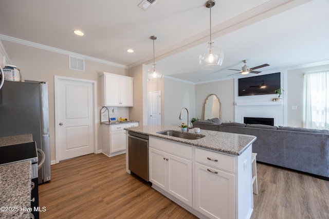 4524 Sweet Williams Ln NW, Wilson, NC 27896 - kitchen with a sink, stainless steel dishwasher, ornamental molding, and wood finished floors