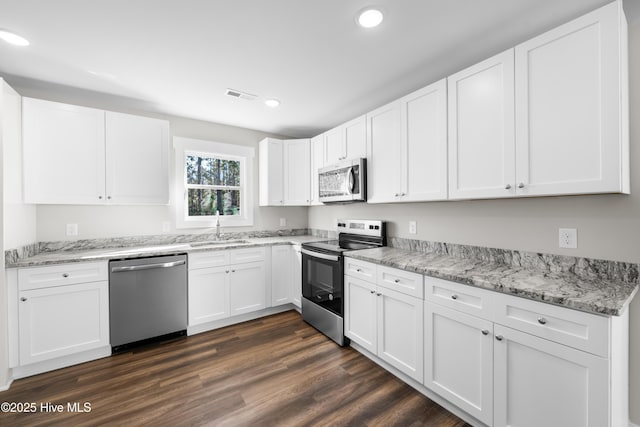 1191 Pierce Rd, Southport, NC 28461 - kitchen featuring a sink, visible vents, recessed lighting, white cabinetry, and appliances with stainless steel finishes