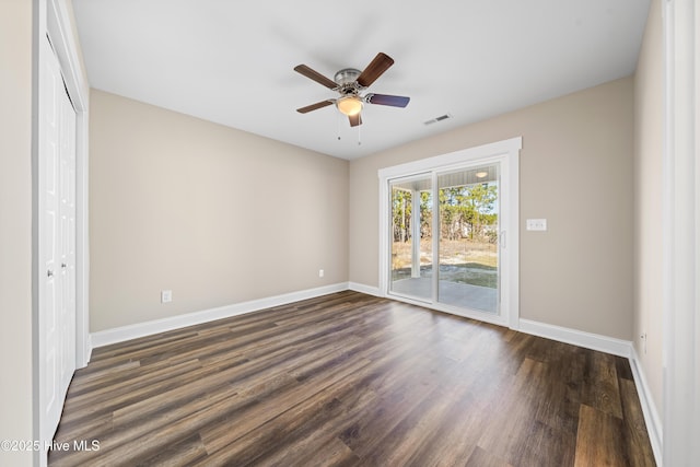 1191 Pierce Rd, Southport, NC 28461 - unfurnished bedroom featuring visible vents, access to outside, baseboards, and dark wood-type flooring