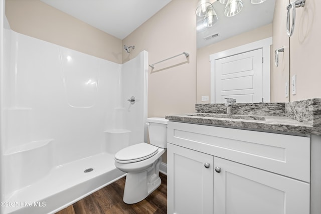 1191 Pierce Rd, Southport, NC 28461 - full bathroom with walk in shower, toilet, visible vents, and wood finished floors
